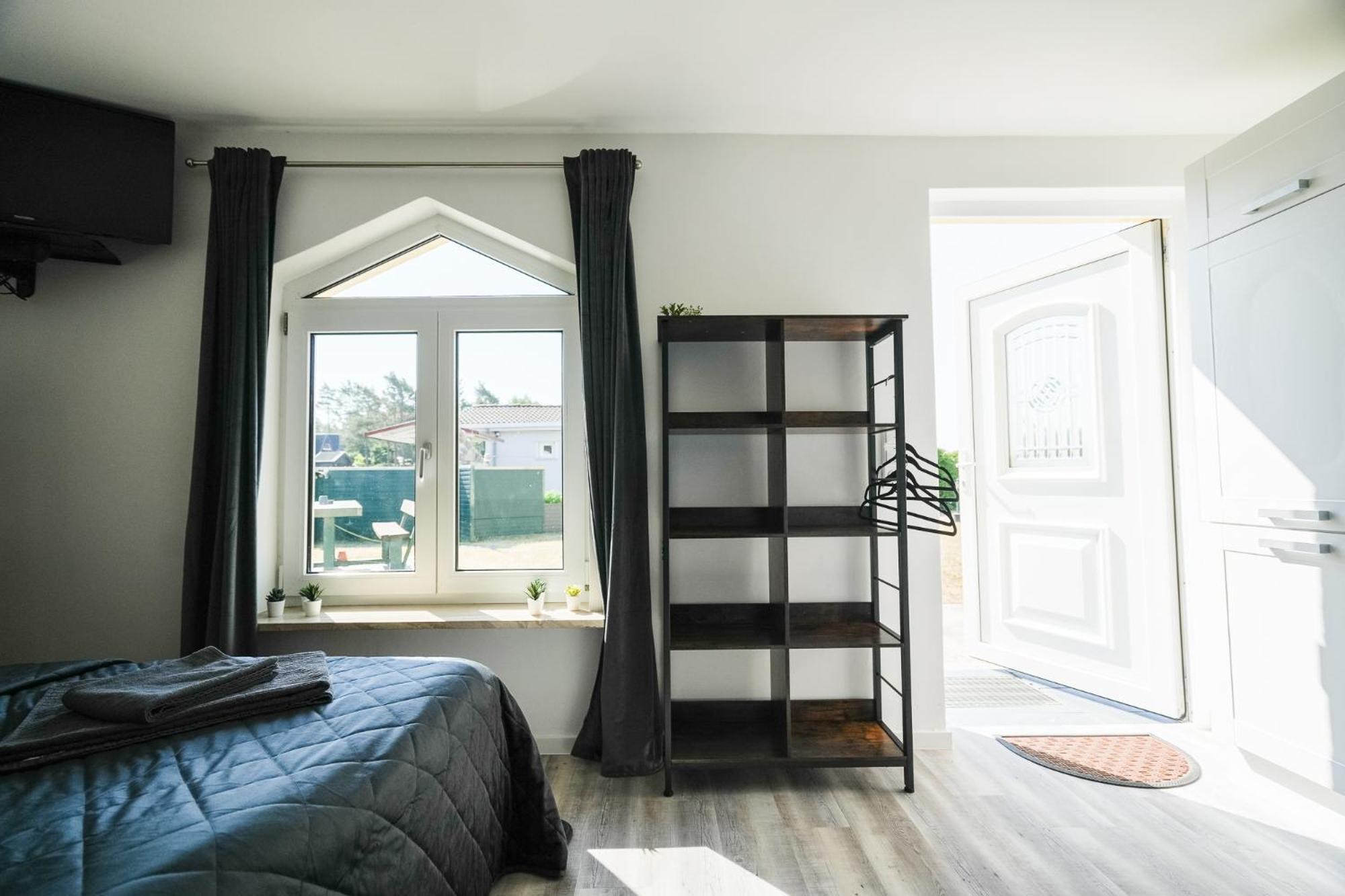 Black Tiger Seaside - Ferienwohnungen Direkt Am See Garden Pokoj fotografie